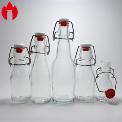 Bouteille en verre moulé clair sur mesure utilisée pour les boissons gazeuses, jus de soude, vin, bière et boissons
