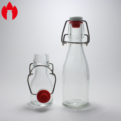 Bouteille en verre moulé clair sur mesure utilisée pour les boissons gazeuses, jus de soude, vin, bière et boissons